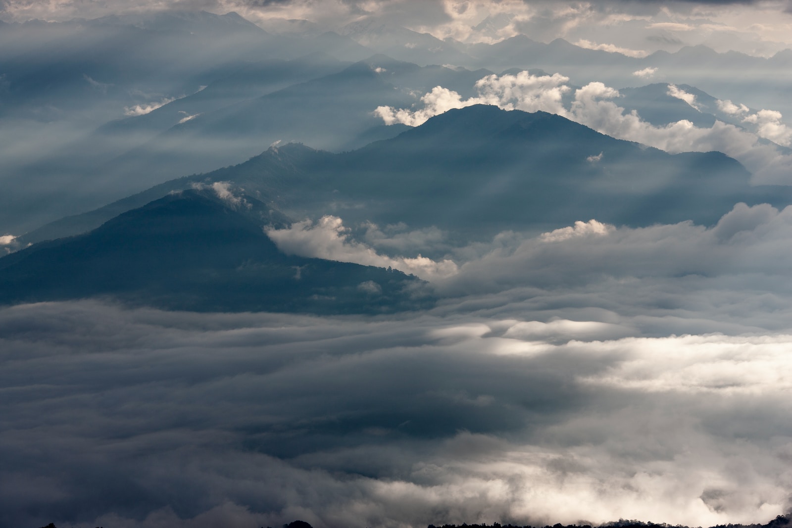 mountain range covered in clouds