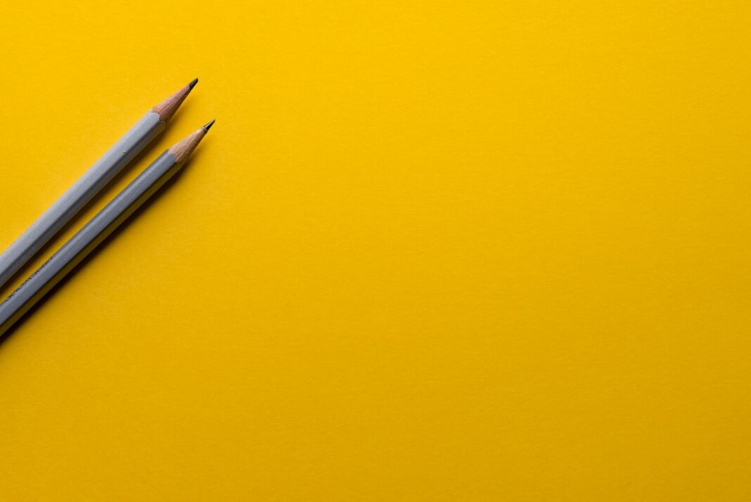 Photo by Joanna Kosinska two gray pencils on yellow surface