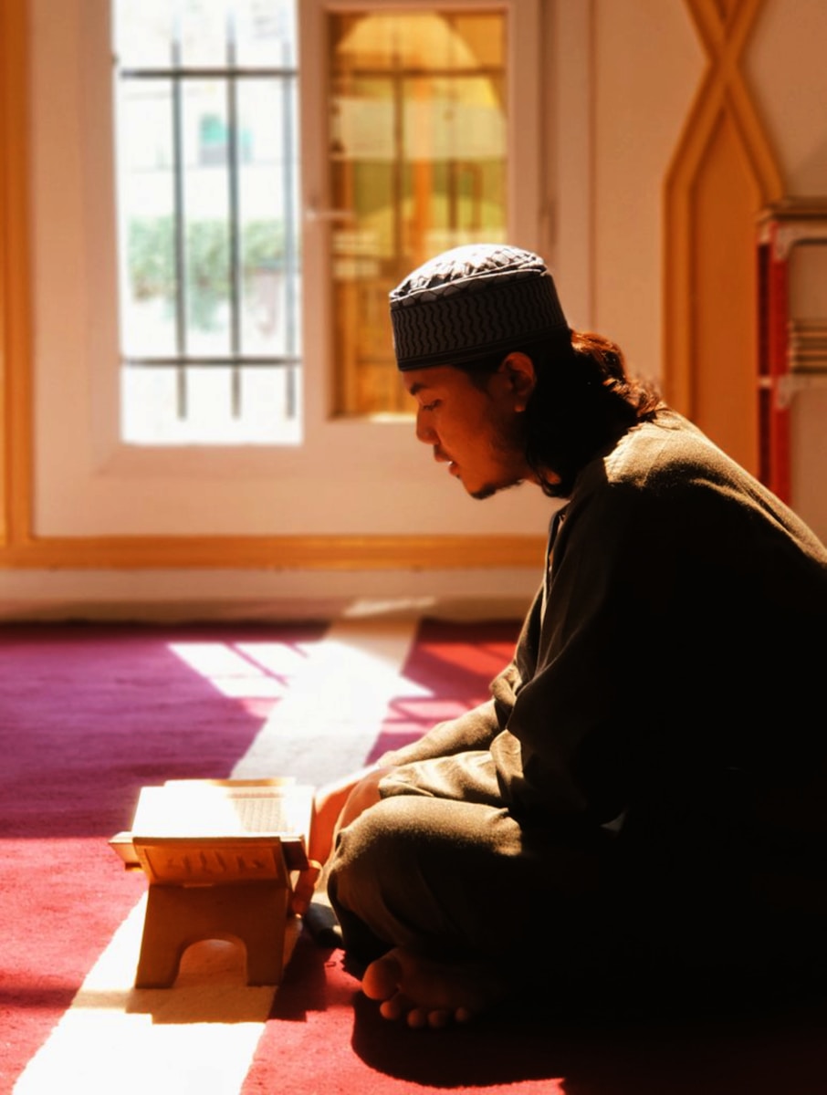 A person sitting on the floor in a room