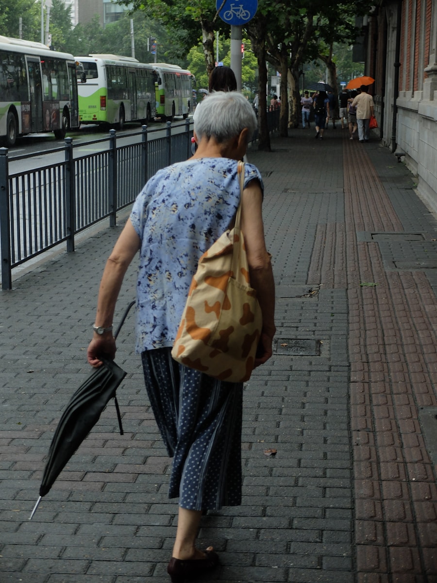 a woman walking down a street holding an umbrella