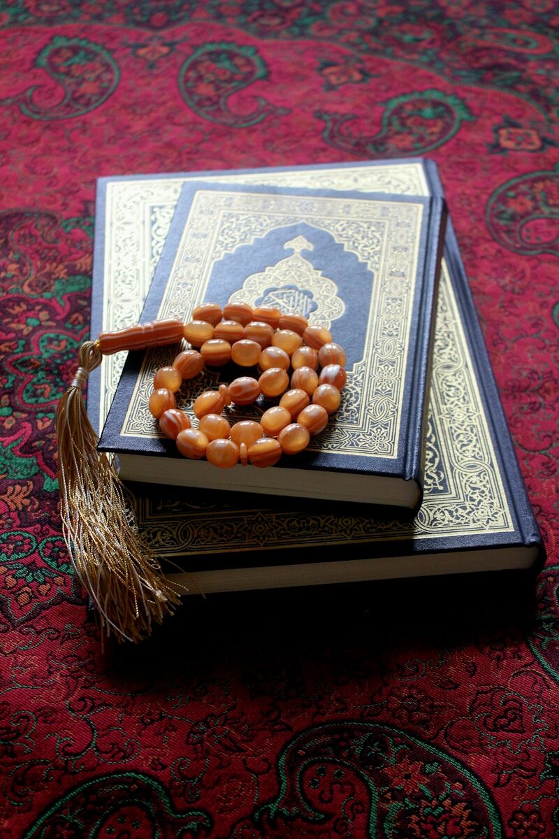 A pile of books sitting on top of a carpet