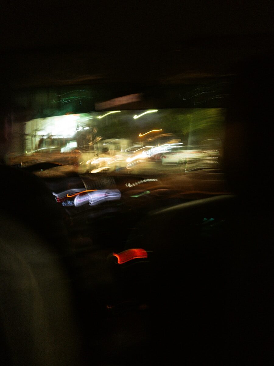 a blurry photo of a city street at night