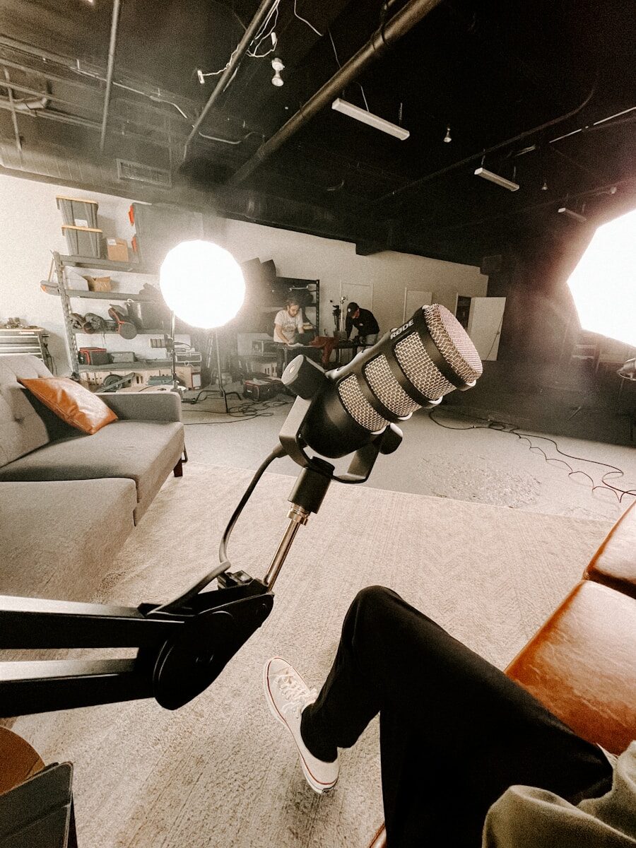 a room with a couch and a microphone in it