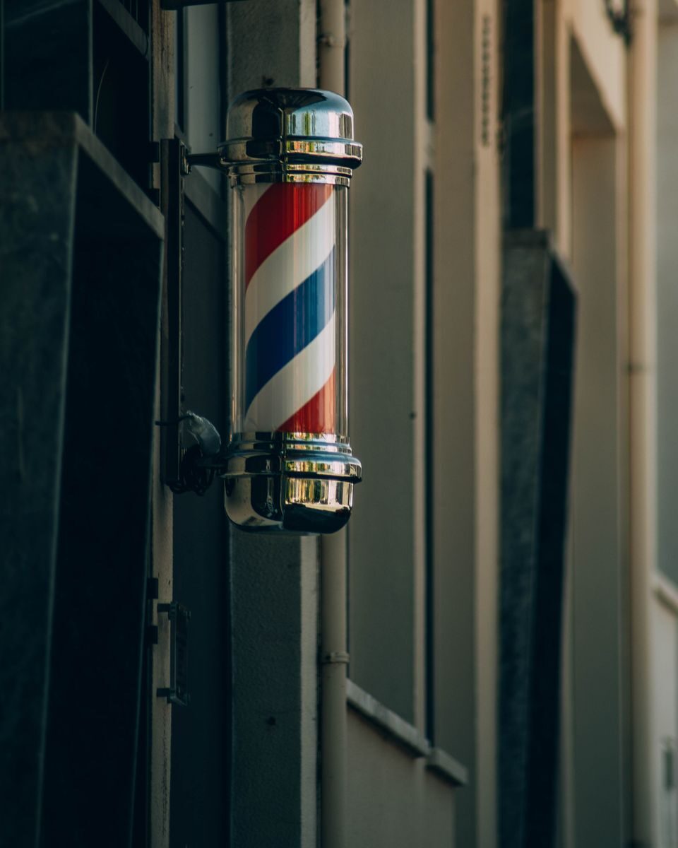 Traditional barber pole in Proença-a-Nova. Symbol of barbershop heritage.