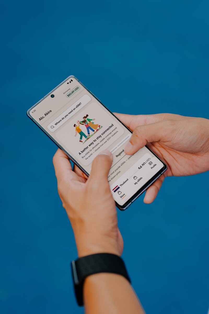 Hands holding a smartphone with a delivery app open