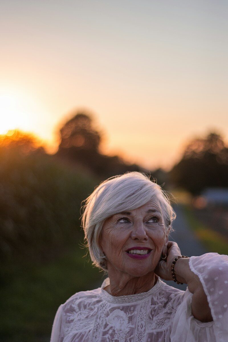 An older woman talking on a cell phone
