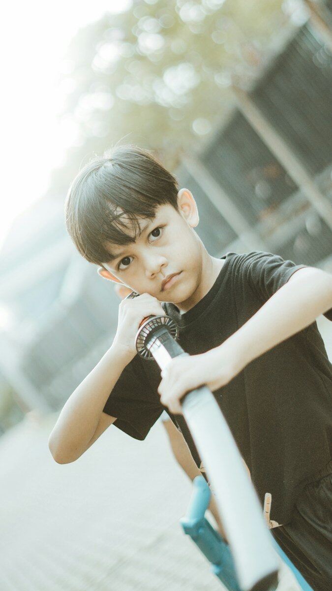 Boy poses with a toy sword